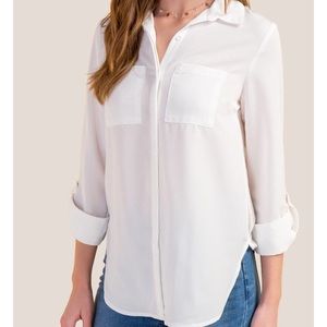 Francesca’s white blouse